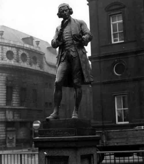 1972. Statue of Joseph Priestley in City Square. Dr Joseph Priestley (1733-1804) was born in Birstall, attended Batley Grammar School and was minister of Mill Hill Chapel from 1763 to 1773. He discovered several gases including oxygen. Statue by Albert Drury. Taken from Leodis, our photographic archive.
