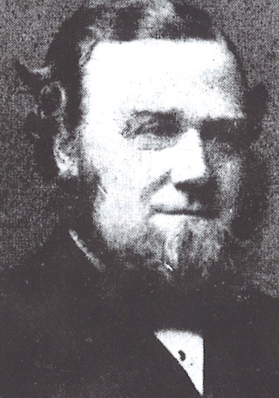 Photo of Israel Roberts, a middle-aged man, with a beard but no moustache. He is wearing a smart suit.