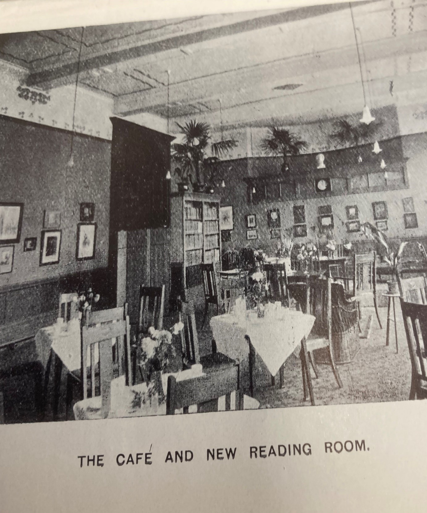 Shows a dining room or cafe with tables and chairs