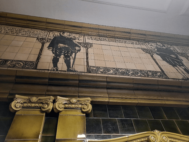 Tiled images of authors in the Morley Library foyer