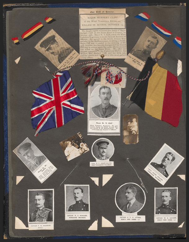 Photographs, flags and newspapers articles pasted into the scrapbook